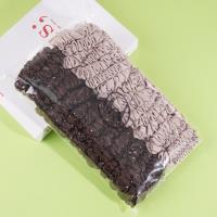 2 pieces of large intestine, marinated with soy sauce, milk coffee sauce, and topped with a rope-like elastic band made from leather