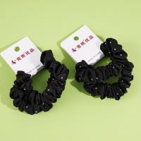 2 pieces of black headbands with rhinestone decorations and elastic bands for ponytails
