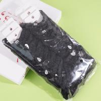 2 pieces of black small intestine tips tied with string and rubber bands in the shape of a heart