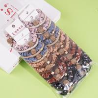 2 pieces of black small intestine tips tied with string and rubber bands in the shape of a heart