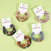 2 large golden ball-studded bead patterned headbands with elastic bands