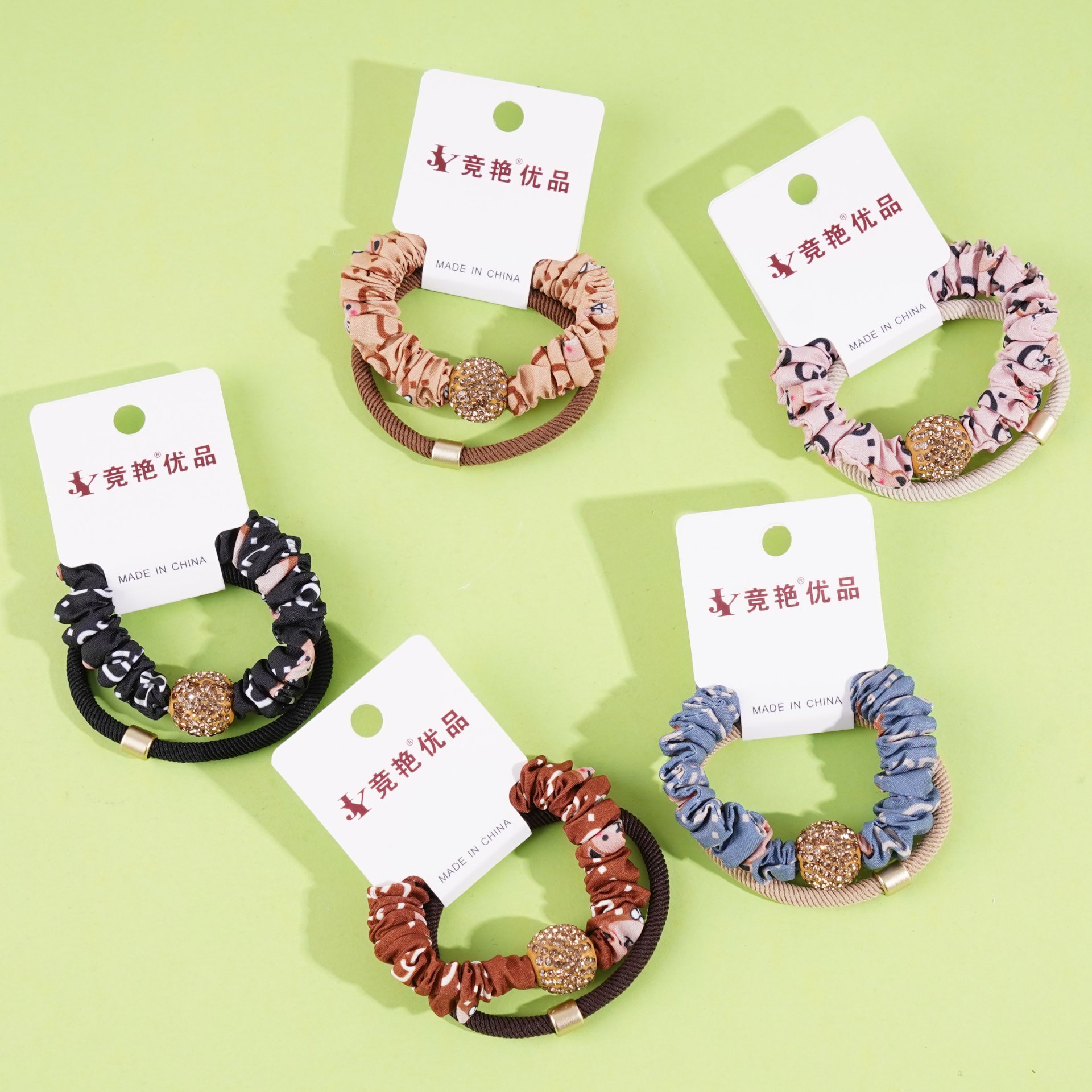 2 large golden ball-studded bead patterned headbands with elastic bands