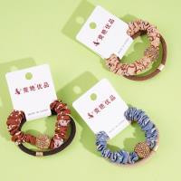 2 large golden ball-studded bead patterned headbands with elastic bands