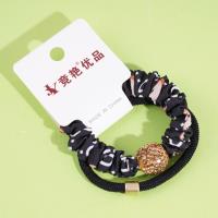 2 large golden ball-studded bead patterned headbands with elastic bands