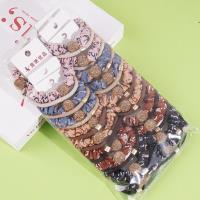 2 large golden ball-studded bead patterned headbands with elastic bands