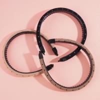 A small sponge-headed hair clip with dark dots