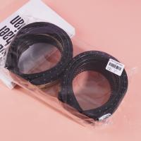 A small sponge-headed hair clip with dark dots