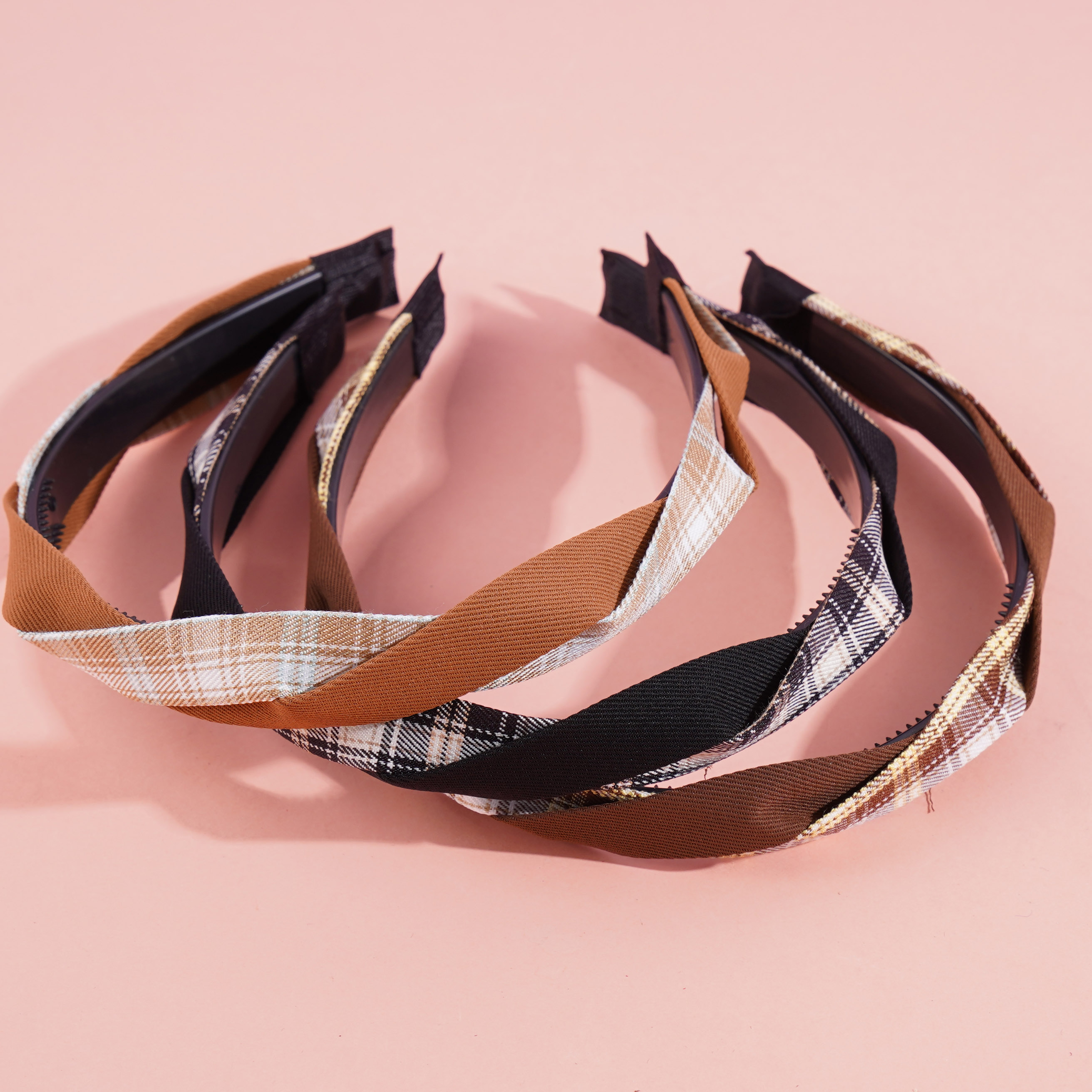 A large-checkered headband with a bow-shaped hair clip