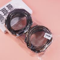 A large-checkered headband with a bow-shaped hair clip