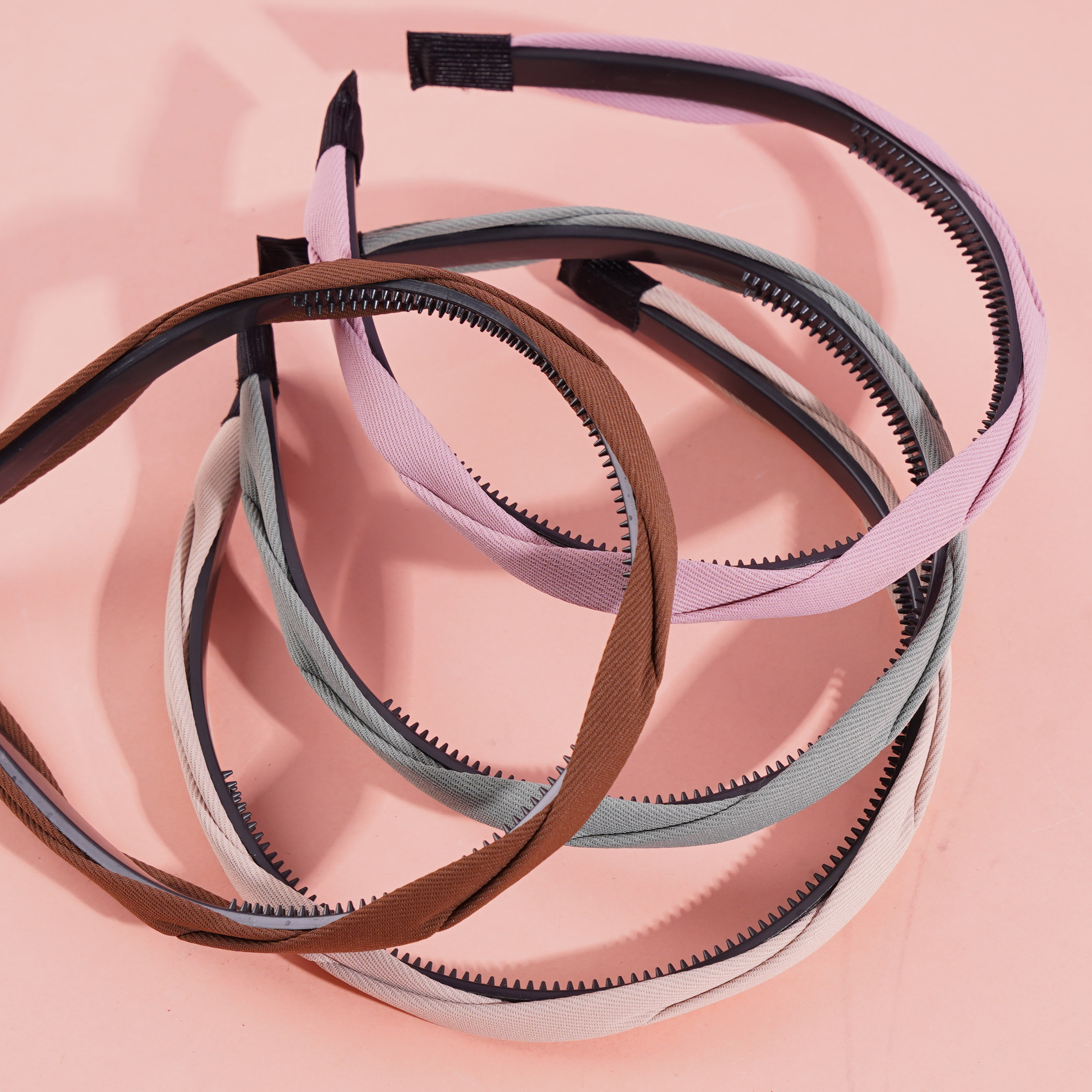 Colored headbands and hair clips with a pretzel-shaped design