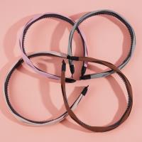 Colored headbands and hair clips with a pretzel-shaped design