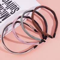 Colored headbands and hair clips with a pretzel-shaped design