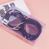 A dark-colored double-diamond headband buckle with a knotted design