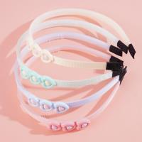 Three heart-shaped children's headbands with hair clips