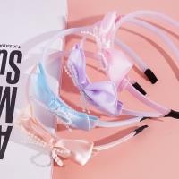 Children's headband with a ruffled bow decoration