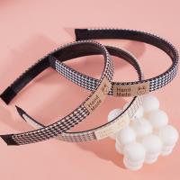 A headband with a thousand-bird pattern and a bow-shaped buckle