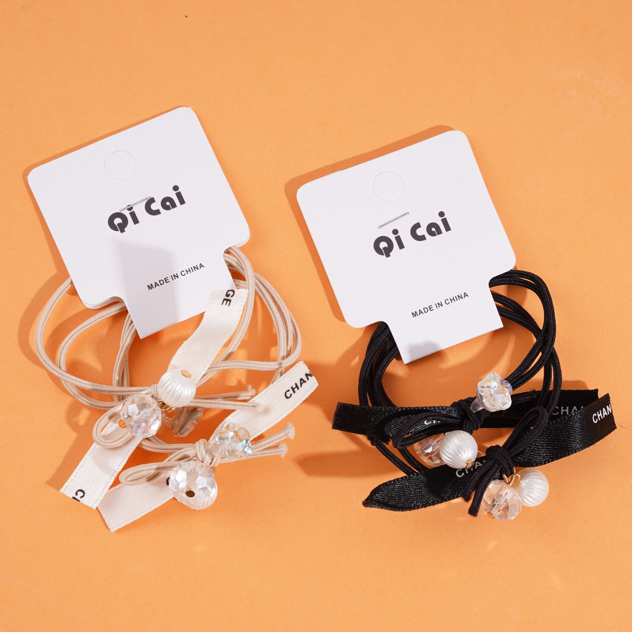 2 pieces of elastic bands with pearl letter heads