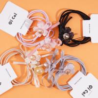 2 من الشرائط المطاطية مع زهور مصنوعة من الخرز.