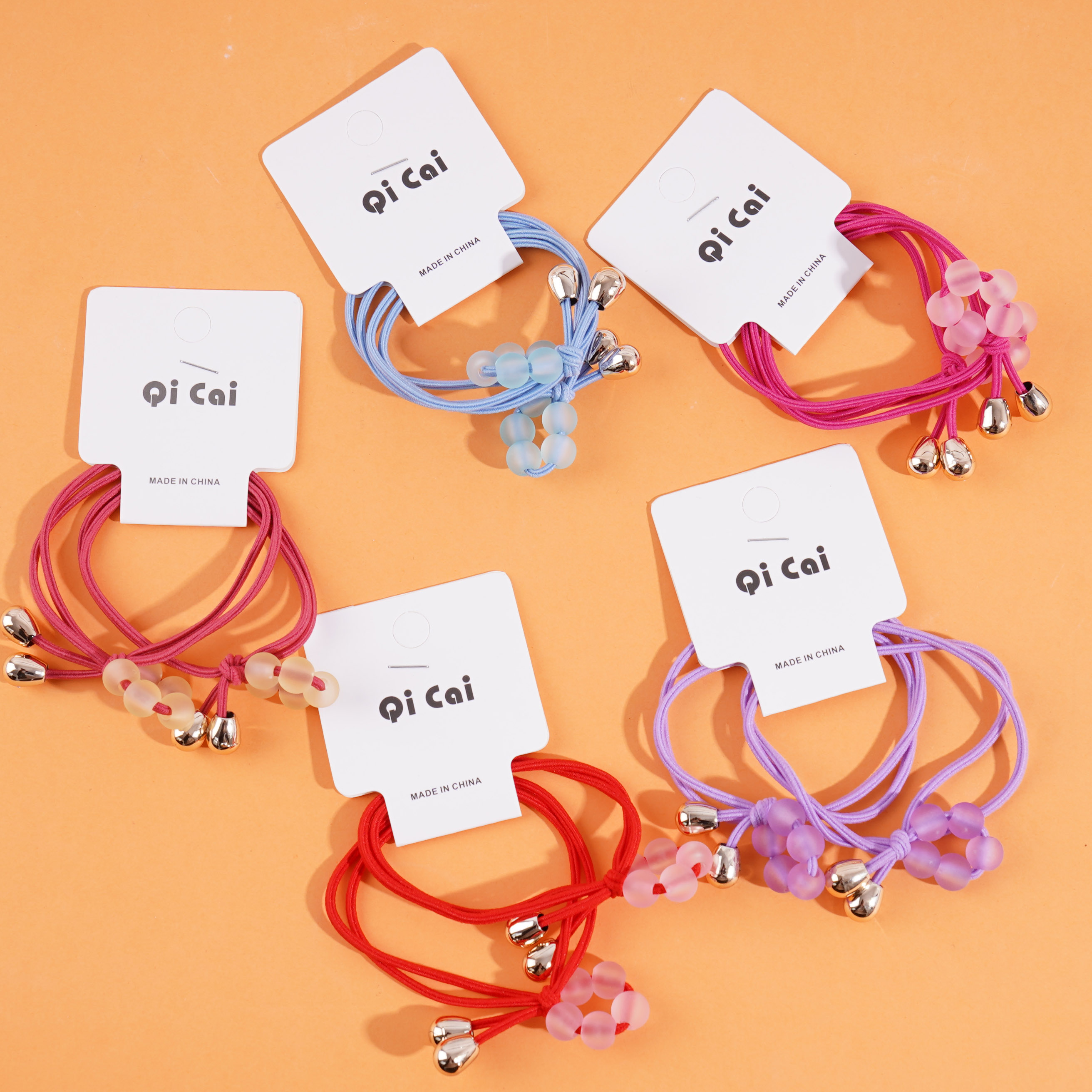 2 headbands with four beads each and elastic bands