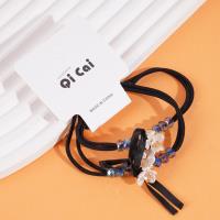 2 small white flower-themed headbands with elastic bands