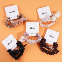 2 crystal flower elastic bands with a loop at the end