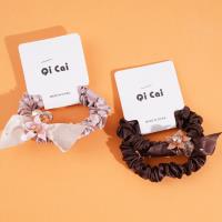 2 crystal flower elastic bands with a loop at the end