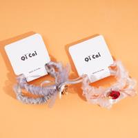 2 pieces of rose sausage with a looped string and rubber bands