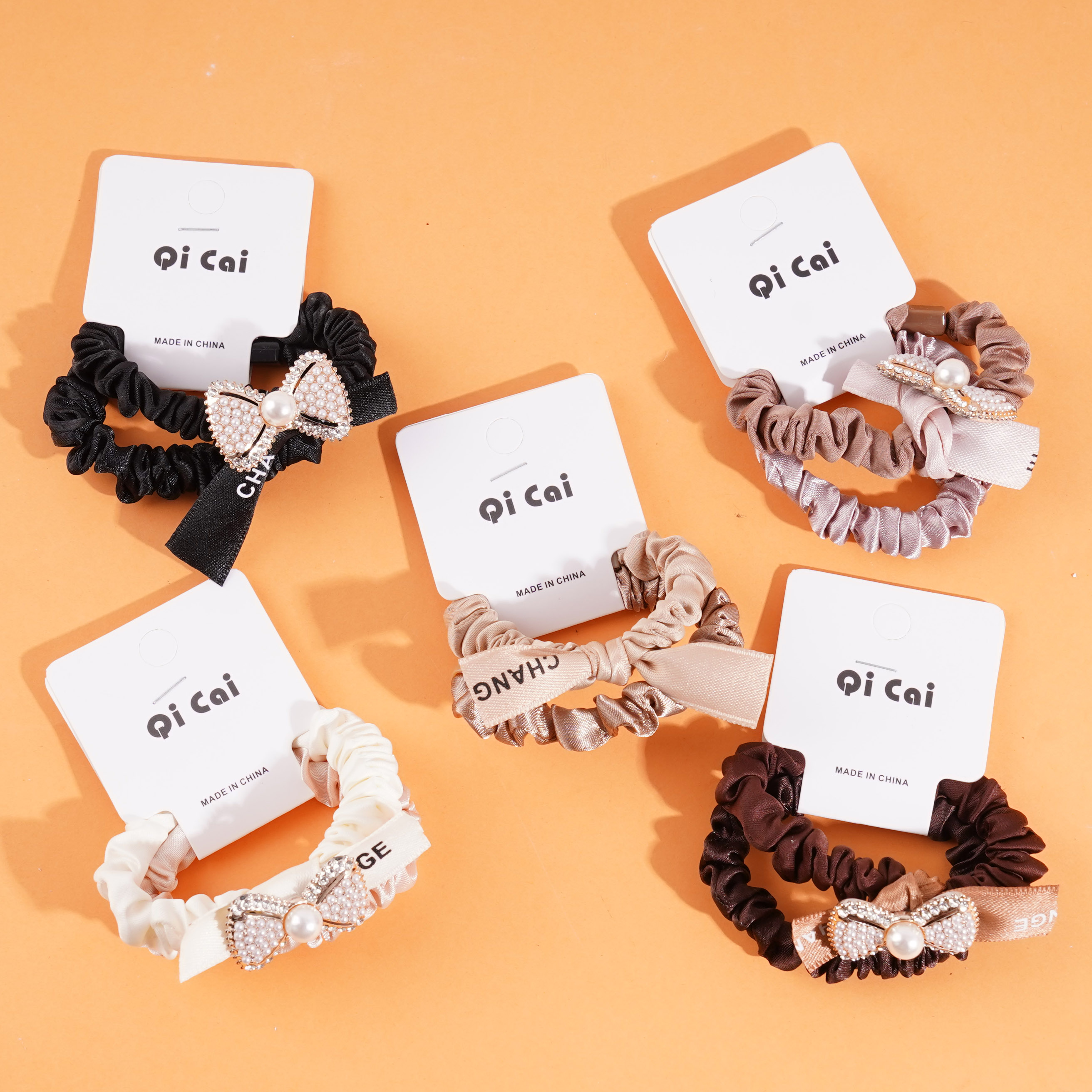 2 gold-plated bow-shaped headbands with elastic bands