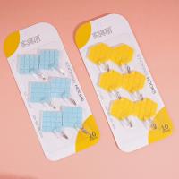 Six diamond-shaped adhesive hooks