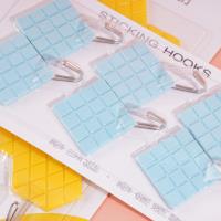 Six diamond-shaped adhesive hooks