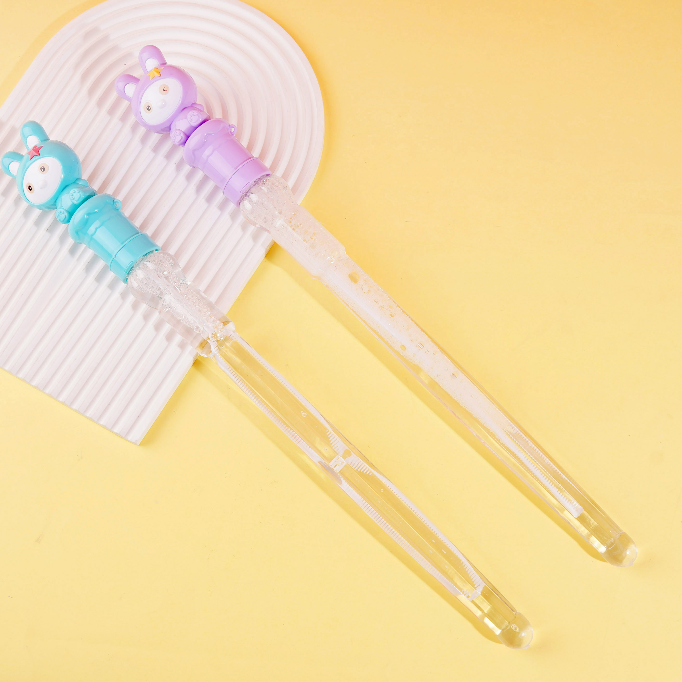 A beautiful rabbit-themed umbrella with a bubble-water-throwing stick attached to it