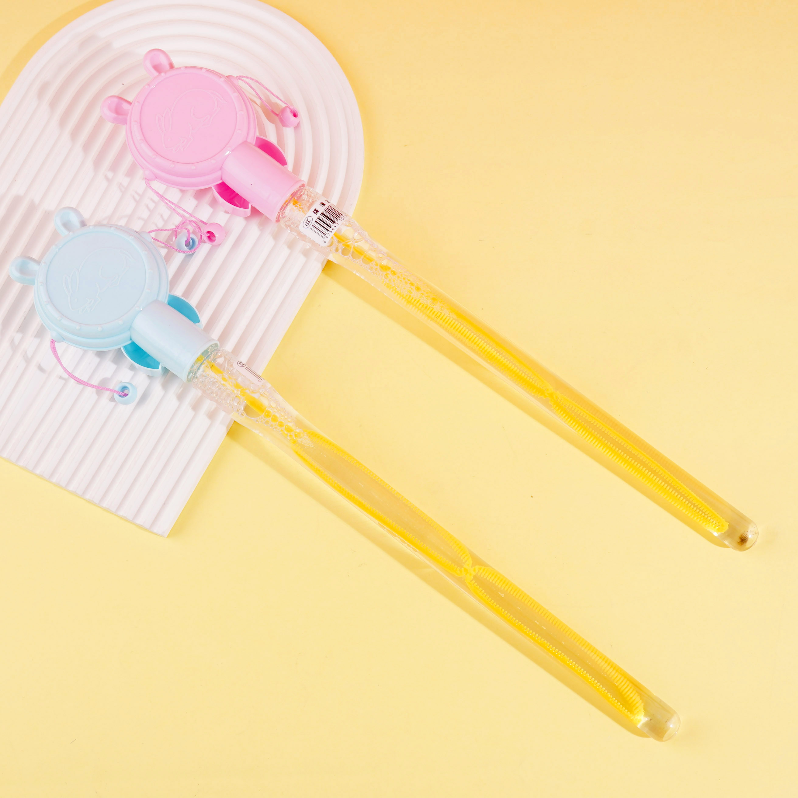 Shake the bubble water and throw the stick