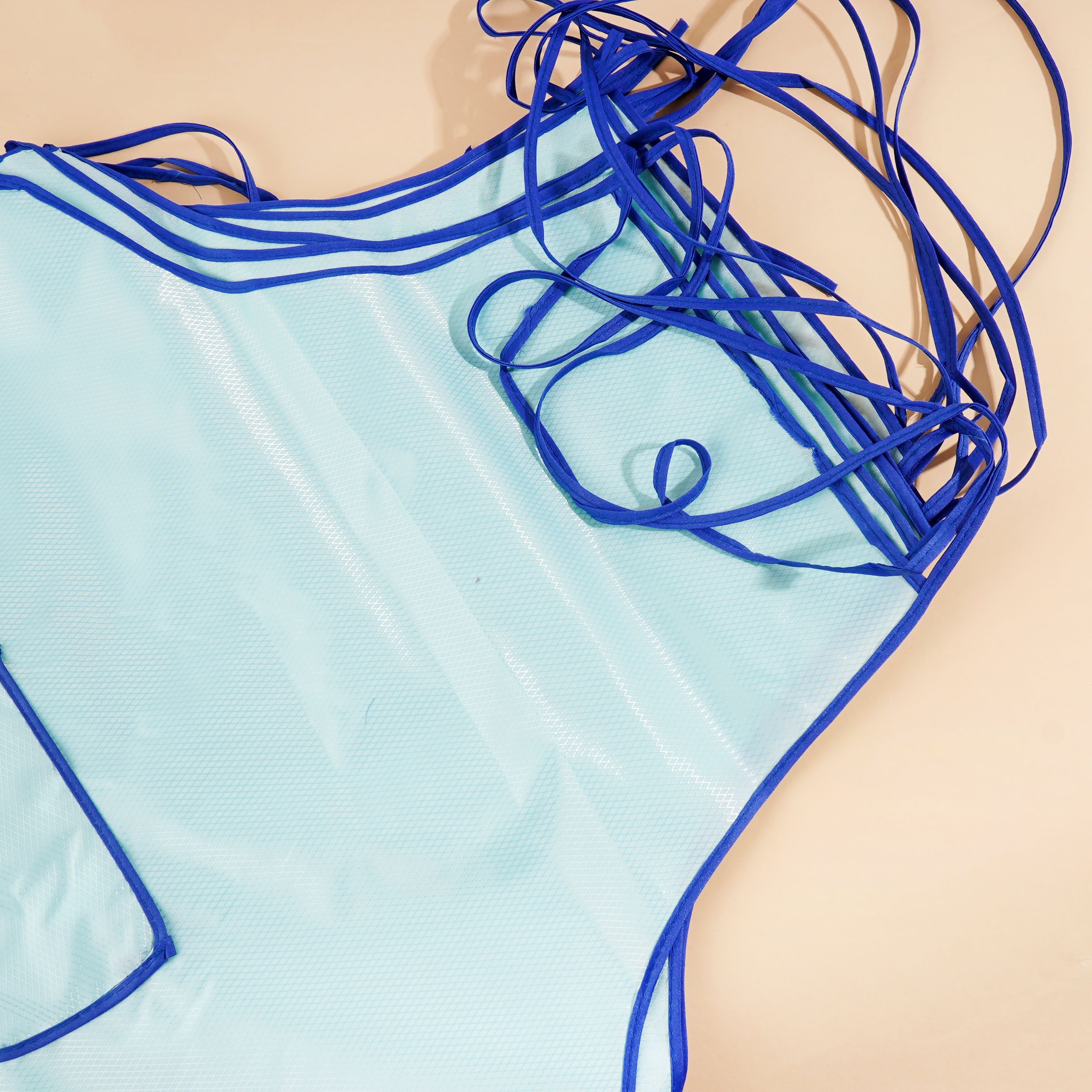 An oversized plain-coloured apron