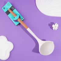 A silicone spatula with a wooden handle and a spoon-shaped head