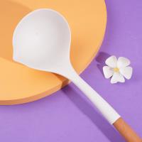 A silicone spatula with a wooden handle and a spoon-shaped head