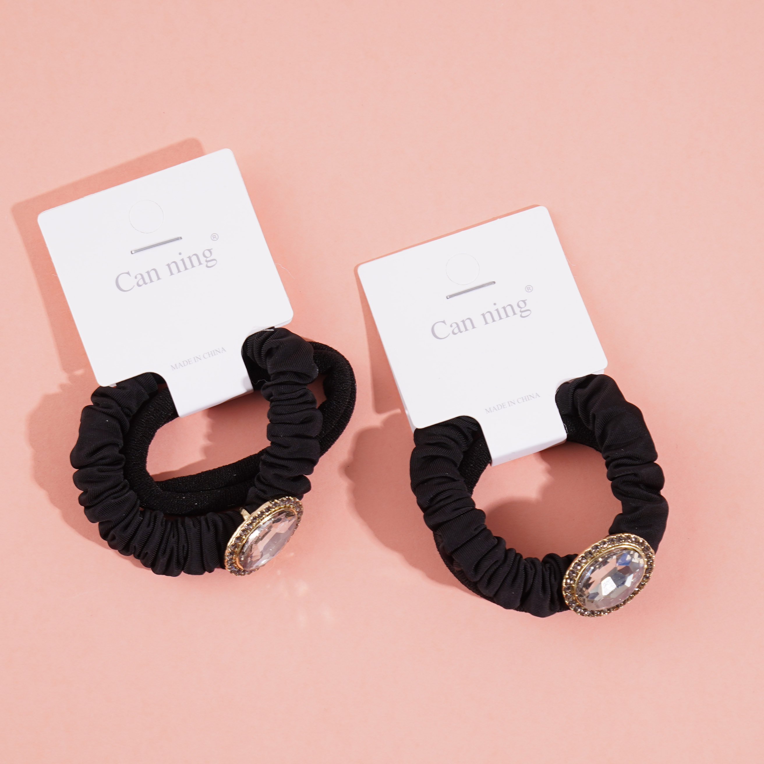 2 boxes of round-cut diamonds, including headbands and rubber bands