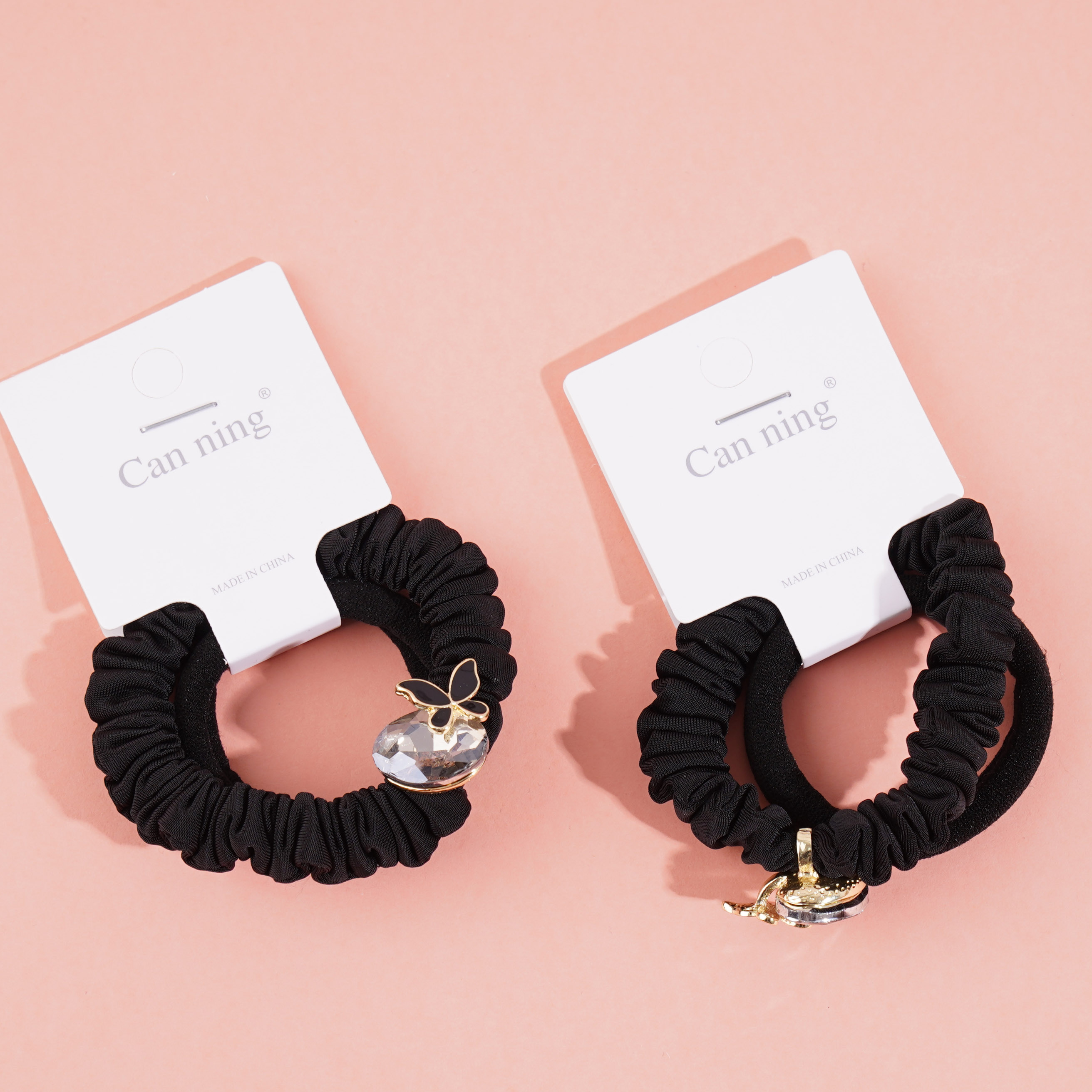 2 pairs of butterfly-shaped jewelry boxes, each containing a headband and elastic bands