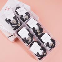 2 heart-shaped diamond boxes containing headbands and rubber bands