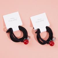 2 red bead-encrusted boxes containing headbands and rubber bands