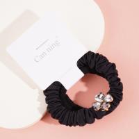 2 four-leaf clover-themed headbands with elastic bands, packaged in a box