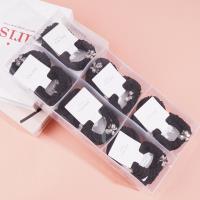 2 four-leaf clover-themed headbands with elastic bands, packaged in a box