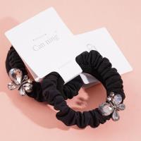 2 large butterfly-shaped jewelry boxes containing headbands and rubber bands