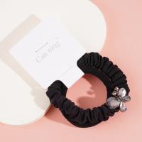 2 large butterfly-shaped jewelry boxes containing headbands and rubber bands