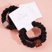 2 square leopard-print headbands with elastic bands, packaged in a box