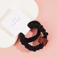 2 square leopard-print headbands with elastic bands, packaged in a box