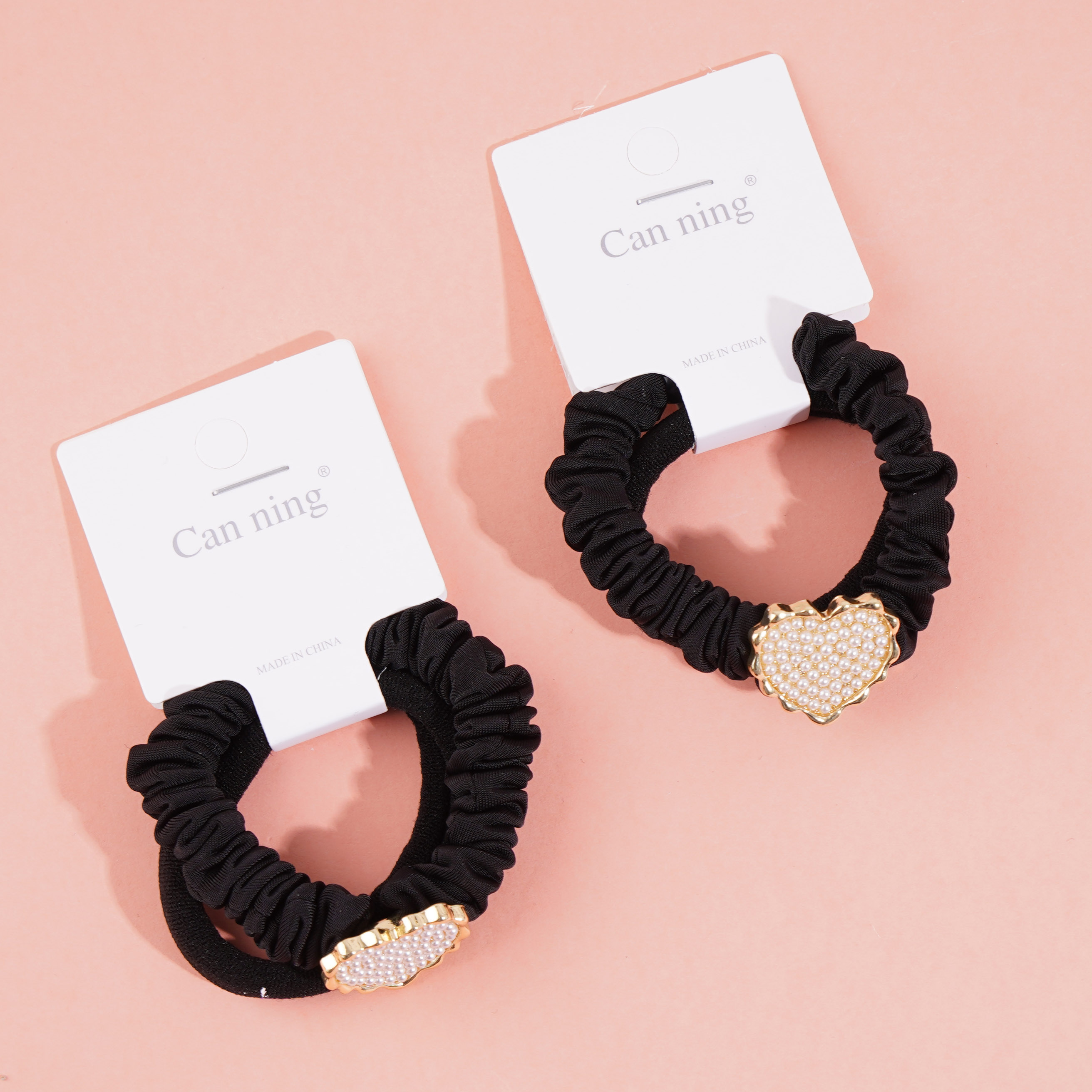 2 pearl-shaped heart-shaped box-packaged headbands and rubber bands