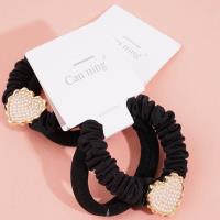 2 pearl-shaped heart-shaped box-packaged headbands and rubber bands