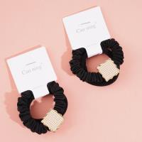 2 square pearl boxes containing headbands and hair ties