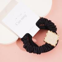 2 square pearl boxes containing headbands and hair ties