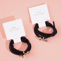 2 bow tie diamond boxes containing headbands and rubber bands